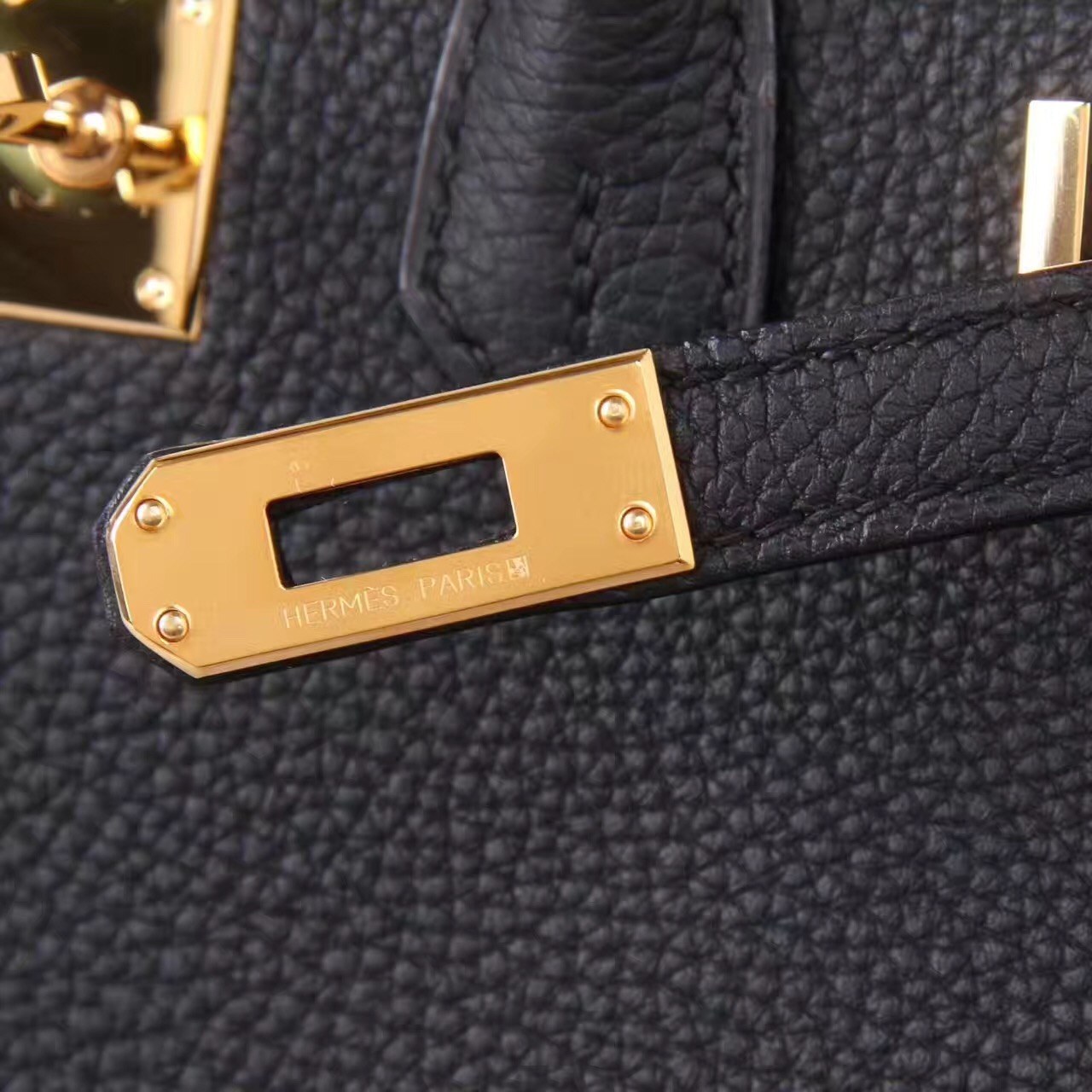 Black Togo leather grain and gold-tone hardware by TheCovetedLuxury