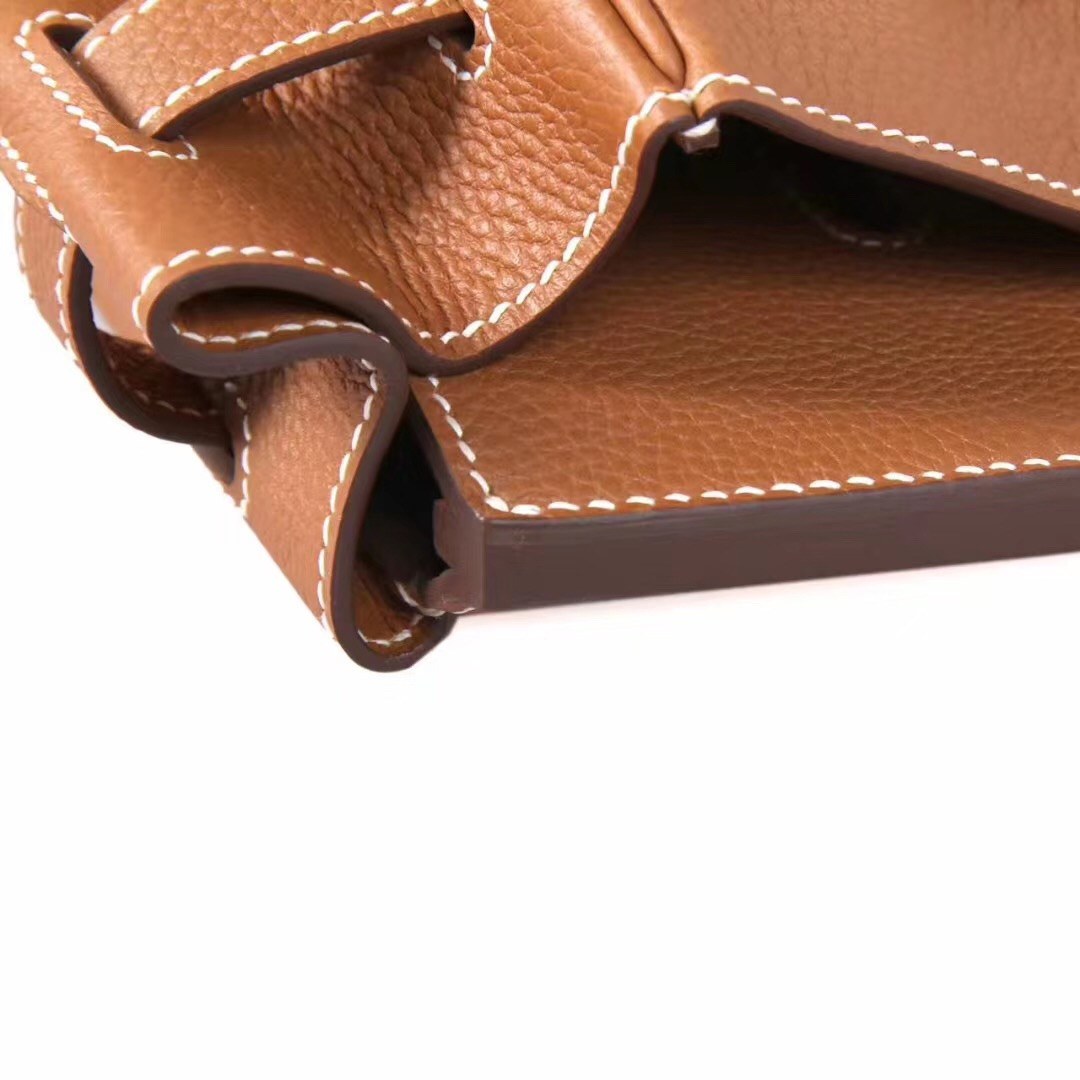 Brown Togo leather side gusset and curved seam by TheCovetedLuxury